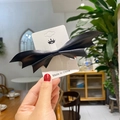 Halloween bat wing hair clip made of black leather on a white display card - Smooth Leather (KQ042604)