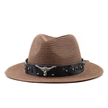 Close-up of woven straw cowboy hat with black leather band and silver bull head detail - M (56-58cm) / Brown