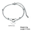 Detail of double-layer stainless steel bracelet with letter pendant and lobster clasp - Letter-Q / Silver