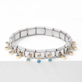 Detail of silver modular link bracelet with gold charms and blue round gemstones - Royal Blue
