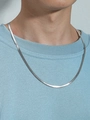 Close-up of a 4mm silver-tone stainless steel snake chain necklace on a male model - Steel Color 5mmx50cm