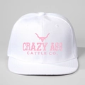 Close-up of white snapback hat featuring pink Crazy Ass Cattle Co embroidery and bull logo - Adjustable / White