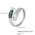 Polished stainless steel spiral ring featuring inset green rhinestones and open design - Number 7 / Steel with Green Rhinestone