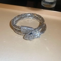 Macro view of silver multi-layered snake bracelet with sparkling crystal rhinestones - Bracelet - Silver