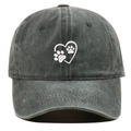 Detailed close-up of white heart and dog paw embroidery on washed dark grey baseball cap - Adjustable / Green