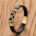 Detalle de pulsera de cuero trenzado negro con símbolo infinito dorado y pedrería - Dorado-D / 19cm