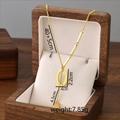 Golden titanium steel tassel necklace featuring oval pendant on a white cushion display - Letter O / Gold