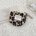 Close-up of leopard print plush coin purse with lamb wool texture and zipper closure - Plush Beige Leopard Print
