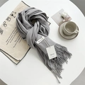 Elegant grey cashmere-feel scarf with long tassels and premium brand label detail - Light Grey