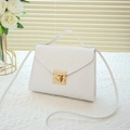 Elegant white woven textured small square bag with golden lock and top handle - White