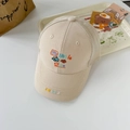 Close-up of beige mesh baseball cap with fish embroidery and my little cutie text - One Size / Beige