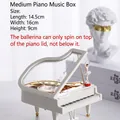 Detailed view of white piano music box with rotating ballerina doll and open lid detail - Medium Piano with Dancing Girl Music Box