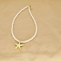 Beaded pearl necklace with a gold starfish pendant featuring an adjustable lobster clasp - Pearl Chain Starfish (G)