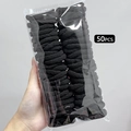 Detailed view of 50pcs high-elastic seamless black hair ties in transparent bag - 50 PCS Set / Black