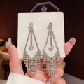 Handheld display of elegant S925 silver needle long tassel earrings with cubic zirconia - Triangle Zircon Tassel (E0064 Silver)