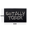 Detail showing embroidered 8x5cm black patch with SOTALLY TOBER white lettering - SOTALLY TOBER / Black with White Letters
