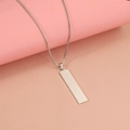 Macro detail of polished stainless steel rectangular pendant on a fine box chain - Steel Color (10*40mm)(MP273)