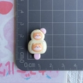 Detailed size view of a yellow cartoon cat resin popsicle charm on a measurement mat - Yellow Corgi Ice Pop