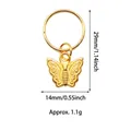 Detail view of a gold alloy butterfly pendant charm for hair braid accessories - Small Butterfly