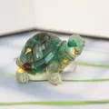 Macro detail of turtle figurine made of green resin and gold leaf for aquarium decor - Dark Green + Gold Foil