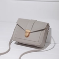 Grey minimalist crossbody bag with lychee texture faux leather and gold metal lock clasp - Gray