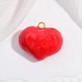 Glossy red heart pendant with a golden metal loop on a white textured background - VD1665 Gold Red Enamel Heart