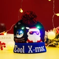 LED knitted Christmas hat in black with Santa and Penguin graphics and Cool X-mas text - Cool Santa Penguin