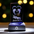 Macro shot of 3D laser engraved crystal with dolphins heart and Sweet Heart text - Double Dolphins with Heart / 5x5x8CM