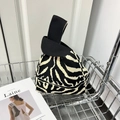 Chic black and white zebra print knitted knot bag with thick black handle in metal cart - Black Zebra