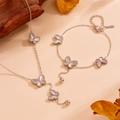 Macro detail of stainless steel butterfly pendant with textured lines and steel beads - Silver Color Butterfly Set