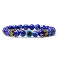 Detail of beaded bracelet with turquoise stones, evil eye bead, and golden crowns - Imperial Stone (03)
