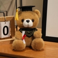 Brown graduation teddy bear in black cap with yellow tassel and congratulations scarf - Bandana Style / Dark Brown