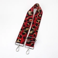 Detailed close-up of wide red leopard print woven strap with silver metal lobster clasps - Red With Silver Buckle
