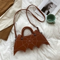 Detail of bat-shaped brown PU leather bag with spiderweb stitching and star rivets - One Size / Dark Brown