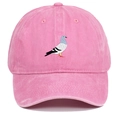 Close-up of pink washed cotton baseball cap featuring detailed white pigeon embroidery - Pink