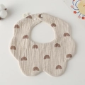Detail of petal-shaped cotton baby bib with rainbow pattern and snap buttons - Gauze Flower Bandage - Brown Rainbow