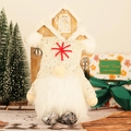 Lighted Christmas gnome plush with gold sequins and white beard in a cozy holiday setting - Off White