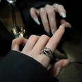 Close-up of minimalist silver geometric ring with black zircon on model finger - Style 1 Adjustable Ring
