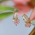 Macro view of gold hoop earrings with pink clover gemstone and white pearl pendant - Original - Pink Crystal Four-Leaf Clover Pearl [Copper Hoop]