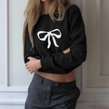 Women's casual short-sleeve black knit sweater featuring a white bow print design - S / Black