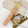 Handmade woven daisy flower keychain in yellow and pink cotton with gold ring clip - Light Yellow + Flesh Pink