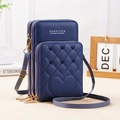 Detail of three-layer zipper design and heart quilted texture on blue crossbody phone bag - Blue
