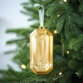 Golden octagonal gemstone Christmas ornament with dimension details on a tree branch - Gold