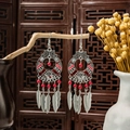 Bohemian silver earrings with red beads and leaf tassels on a vintage wooden display - Silver + Red Enamel + Red Beads (E5965)