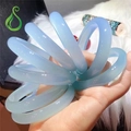 Close-up of sky blue translucent agate chalcedony bangles on white faux fur background - Medium Wide Bangle Style / Inner Diameter 58-59mm / Sky Blue