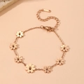 Rose gold stainless steel bracelet featuring seven delicate daisy floral motifs with clasp - 7 Daisy Bracelet Rose Gold (B417)