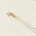 Golden necklace with number 7 pendant and pavé cubic zirconia inlay stones - L