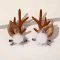Detail of Christmas reindeer antler hair clips with plush brown fabric and white pom-poms - Christmas Antler Hair Clips - White Pom Coffee