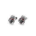 Detail view of punk skull stud earrings with red crystal eyes and vintage silver finish - Red-Eyed Skull Style (KE71200)