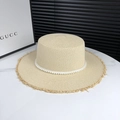 Elegant beige straw flat top hat with pearl band and frayed edges for women - Adjustable / Beige